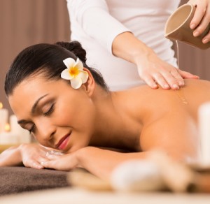 Relaxed Woman Receiving A Back Massage At Health Spa